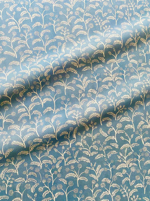 Margaux linen by Claire de Quénetain in grey, in soft folds showing delicate sprigs
