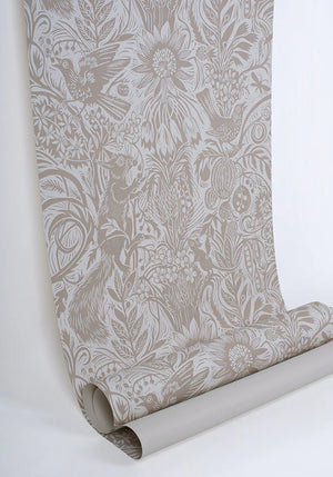 Squirrel and Sunflower wallpaper by St. Jude's in pink, partly unrolled roll showing squirrels and sunflowers