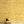 Wren wallpaper by St. Jude's in yellow, wrens among leaves above a sideboard
