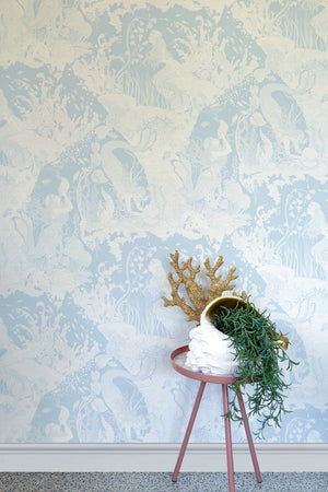 Mermaids wallpaper by Dupenny in pale blue, mermaids and waves on a feature wall