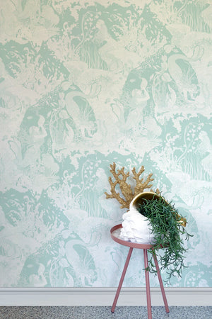 Mermaids wallpaper by Dupenny in pale green, mermaids and waves in an interior setting