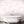 Mermaids wallpaper by Dupenny in pale pink, mermaids and waves in a bathroom setting