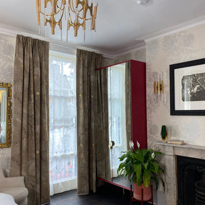 Metamorphasis linen by The Monkey Puzzle Tree in grey and green, a metamorphosis design made into curtains