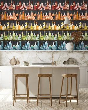 Mixology wallpaper by Brand McKenzie in cream, shelves of colourful bottles in a kitchen