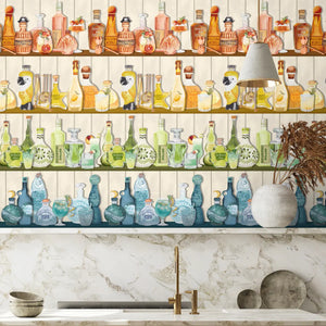 Mixology wallpaper by Brand McKenzie in cream, shelves of colourful bottles behind bar stools
