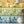 Mixology wallpaper by Brand McKenzie in multicolour, close-up of shelves of colourful bottles
