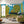 Silva grasscloth by Dami and Em Design in blue and green, painted trees in a living room