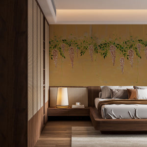 Blossom Veil wallpaper by Dami and Em Design in ochre, trailing blossom garlands in a bedroom