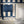 Scallop Lane wallpaper by Liberty James Studio in navy, roll showing scalloped stripes