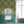 Molten Mosaic wallpaper by Liberty James Studio in yellow, green and blue, a kaleidoscope mosaic in a bathroom