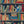 Monkey Library wallpaper by Brand McKenzie in blue, close view of monkeys in a bookcase