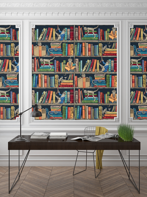 Monkey Library wallpaper by Brand McKenzie in navy, monkeys in a bookcase behind a desk in a home office