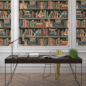 Monkey Library wallpaper by Brand McKenzie in green, monkeys in a bookcase behind a desk in a home office