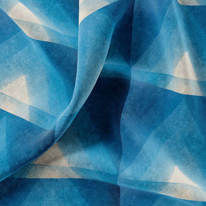 Motif velvet by Tatie Lou in blue, in soft folds showing geometric pyramids