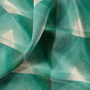 Motif velvet by Tatie Lou in green, draped, showing geometric pyramids