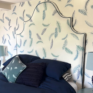 Newtown Creek wallpaper by XV Interiors in cream, drifting feathers in a living room