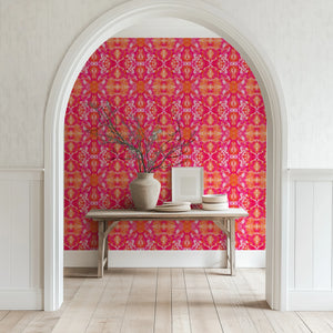 Naples wallpaper by Liberty James Studio in pink, an ornate kaleidoscope design in a styled room setting