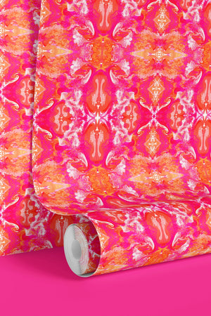 Naples wallpaper by Liberty James Studio in pink, partly unrolled roll showing an ornate kaleidoscope design