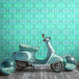 Naples wallpaper by Liberty James Studio in turquoise, an ornate kaleidoscope design on a feature wall