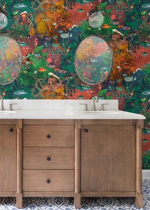 Octopus wallpaper by Brand McKenzie in green and coral, octopus and sea life in a bathroom setting