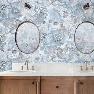 Octopus wallpaper by Brand McKenzie in pale blue, octopus and sea life in a bathroom