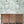 Octopus wallpaper by Brand McKenzie in mint green, octopus and sea life in a bathroom