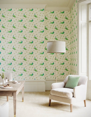 Sustainable Olive and Dot Peacock wallpaper by Seed Home Designs in blue and green in a living room