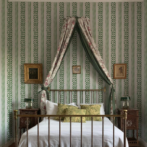 Olive wallpaper by Annika Reed in green, olive branch stripes in a bedroom