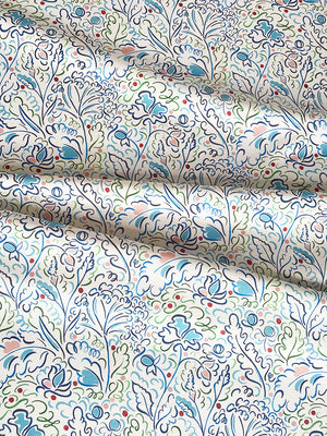 Ombeline linen by Claire de Quénetain in pink, draped, showing a hand-painted floral design