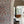 Palamara wallpaper by Deus ex Gardenia in blue and red, mirrored birds and flowers in a hallway