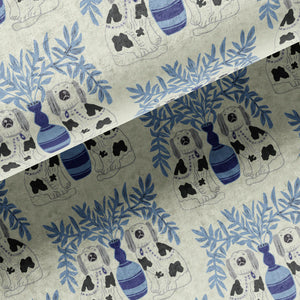 Pair of Dogs velvet by Annika Reed in blue, in soft folds showing pairs of dogs and vases
