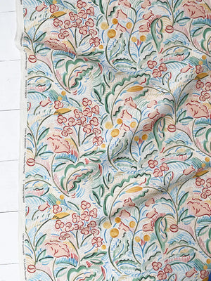 Paloma wallpaper by Claire de Quénetain in pink and green, draped, showing a hand-painted floral design