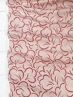 Paola linen by Claire de Quénetain in pink, full repeat of looping line work