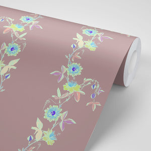 Passion Flower wallpaper by Tatie Lou in dusky pink, partly unrolled roll showing trailing passion flowers