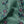 Passion Flower velvet by Tatie Lou in green, draped, showing trailing passion flowers