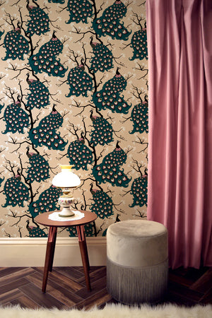 Peacock wallpaper by Dupenny in green, peacocks in branches on a feature wall