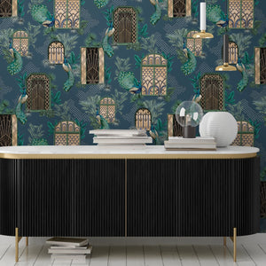 Peacock Manor wallpaper by Brand McKenzie in indigo blue, peacocks and arched windows above a sideboard