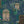 Peacock Manor wallpaper by Brand McKenzie in indigo blue, detail of peacocks and arched windows
