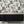 Peacock Manor wallpaper by Brand McKenzie in pink, peacocks and arched windows above a cabinet