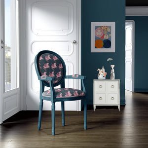 Pegasus linen by Annika Reed in navy and pink, winged horses upholstered on an armchair