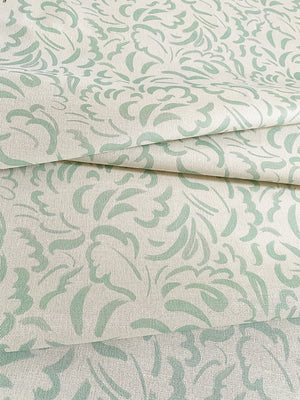 Pia linen by Claire de Quénetain in light green, flat sample of scattered leaves