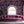 Plethora of Pansies wallpaper by Victoria Sanders in pink, painted pansies in a living room