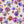 Plethora of Pansies wallpaper by Victoria Sanders in cream, full repeat of painted pansies