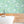 Pond Life wallpaper by Brand McKenzie in aqua, lily pads and pond life in a bathroom