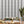 Popsicle in Five Shades of Grey wallpaper by Liberty James Studio in grey and white, wavy popsicle stripes in a living room