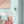 Popsicle wallpaper by Liberty James Studio in duck egg blue, wavy popsicle stripes behind a daybed in a child's room