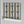Popsicle wallpaper by Liberty James Studio in gold and navy, roll showing wavy popsicle stripes