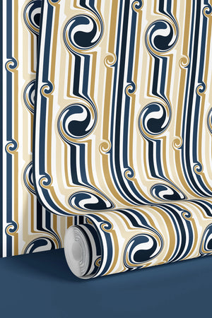 Popsicle wallpaper by Liberty James Studio in gold and navy, partly unrolled roll showing wavy popsicle stripes
