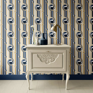 Popsicle wallpaper by Liberty James Studio in gold and navy, wavy popsicle stripes above a sideboard