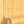 Popsicle wallpaper by Liberty James Studio in yellow, partly unrolled roll showing wavy popsicle stripes
